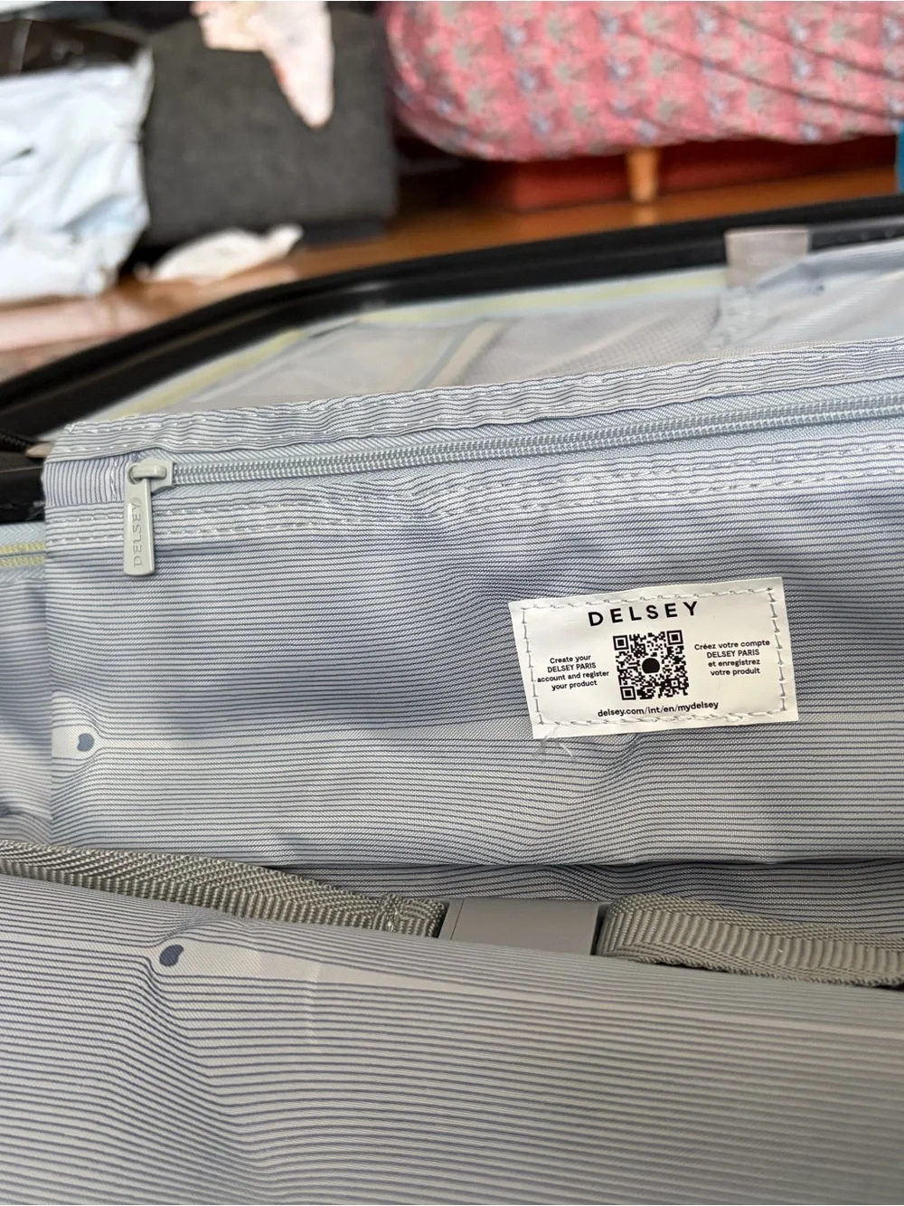 Delsey Paris 20” Carry-On Hardside Spinner Luggage – Silver/Gray